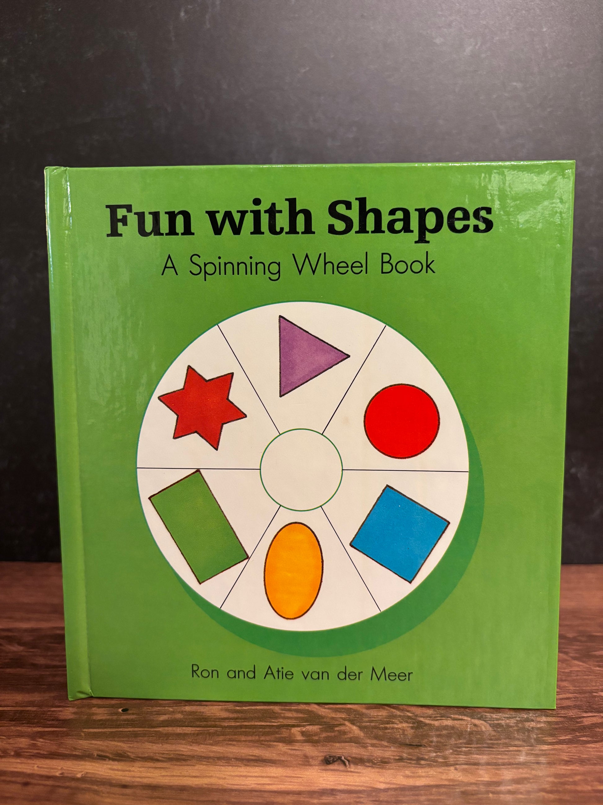 "Fun With Shapes: A Spinning Wheel Book" by Ron and Atie van der Meer (Preowned Boardbook)