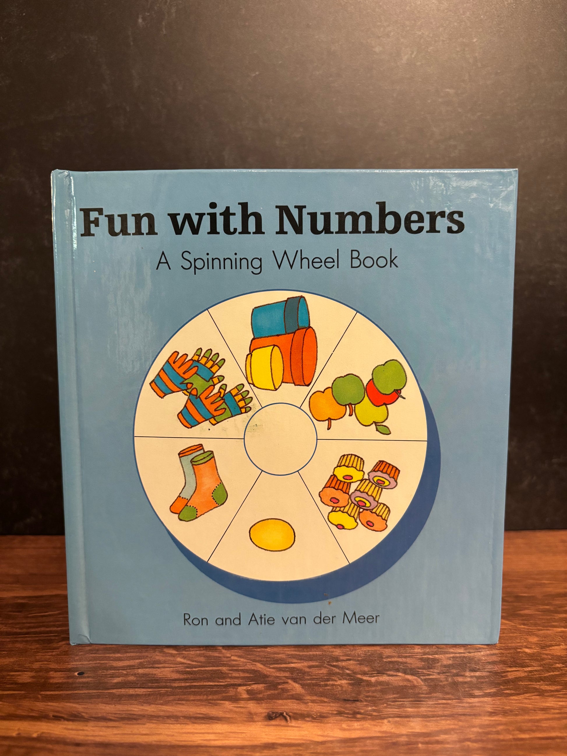 "Fun With Numbers: A Spinning Wheel Book" by Ron and Atie van der Meer (Preowned Boardbook)
